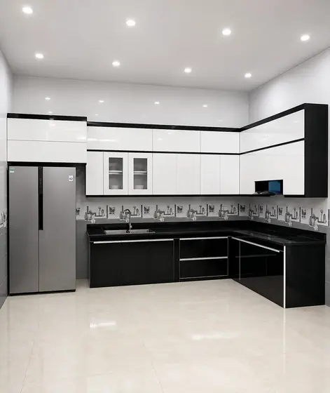 Custom black and white plywood modular kitchen designed by Lucky Enterprises Chennai