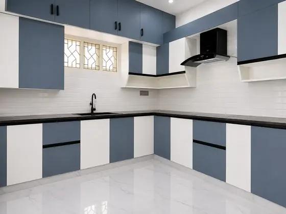 Blue and white modular kitchen, completed by Lucky Enterprises