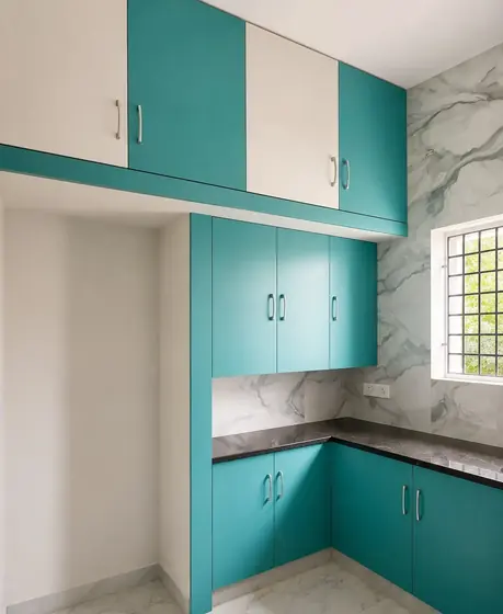 Teal White Marble Modular Kitchen, completed by Lucky Enterprises