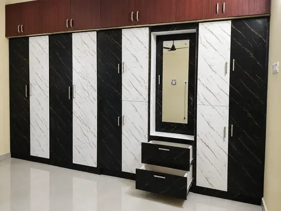uPVC wardrobe with black white marble finish and mirror in Chennai home